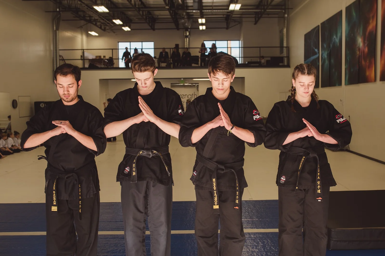 A teens karate student concentrating during a drill at Kona Karate